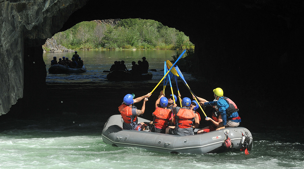 Paddle High Five After a Successful Tunnel Chute Run