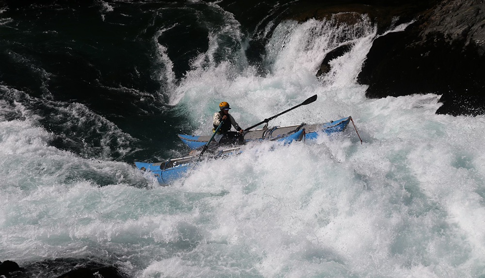 Skye rowing the catamaran on Cherry Creek